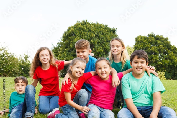 Fototapeta Group of happy kids showing unity