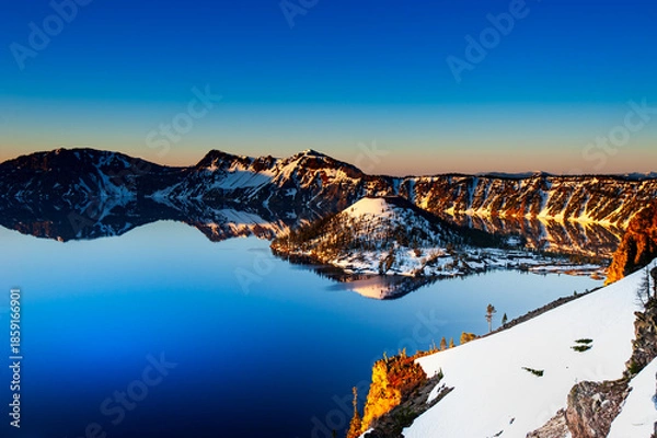 Fototapeta Sunrise Reflection at Crater Lake with Snow Covered Wizard Island, Oregon