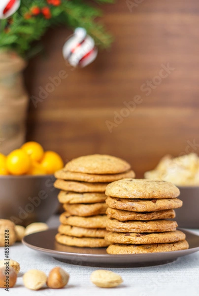 Fototapeta freshly baked chocolate chip cookies on a table with blurred background.