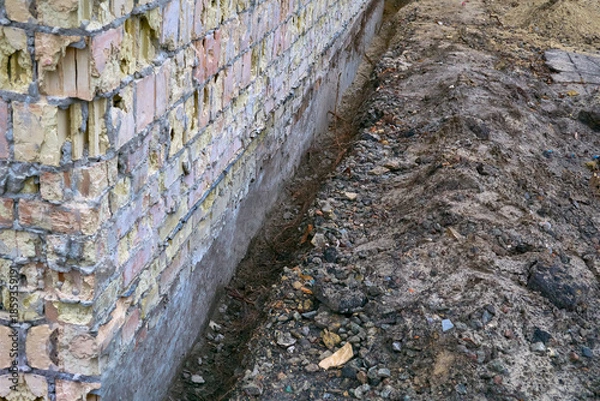 Obraz Preparing the building foundation for reinforcement by pouring concrete