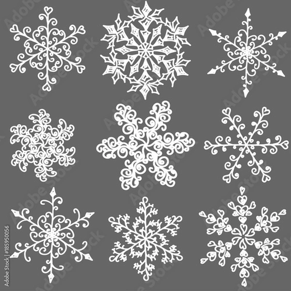 Fototapeta A set of hand-drawn black-and-white snowflake