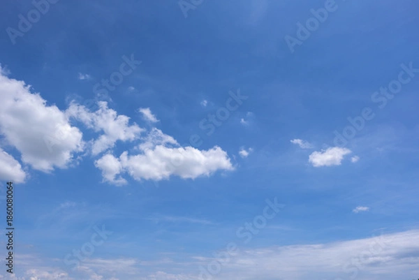 Obraz clear blue sky background,clouds with background, Blue sky background with tiny clouds. White fluffy clouds in the blue sky. 
Captivating stock photo featuring the mesmerizing beauty of the sky 