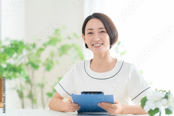 Obraz カウンセリングをする女性エステティシャン