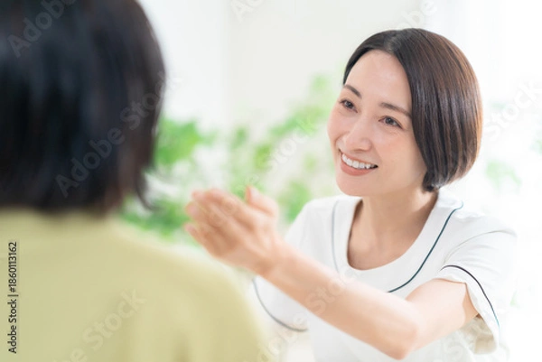 Obraz カウンセリングをする女性エステティシャン