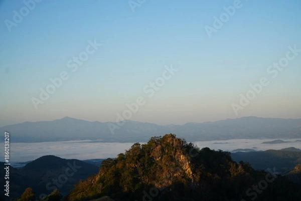 Obraz Mountain Range Under Clear Blue Sky with Soft Clouds