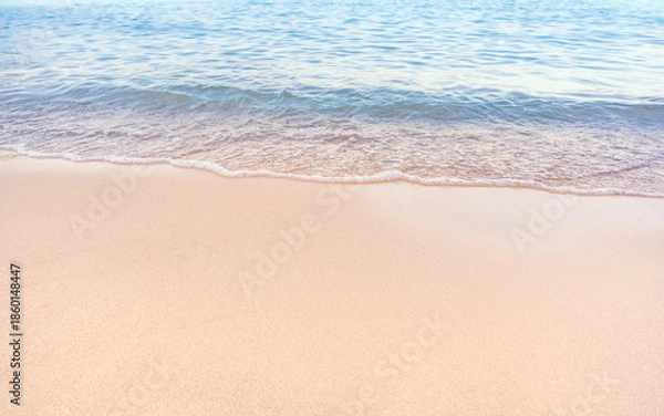 Obraz Soft blue ocean waves gently lapping onto a pristine tropical sandy beach