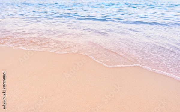 Obraz Soft blue ocean waves gently lapping onto a pristine tropical sandy beach