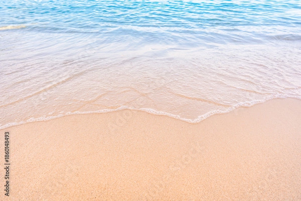 Obraz Soft blue ocean waves gently lapping onto a pristine tropical sandy beach