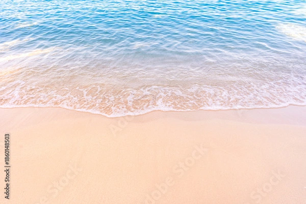 Obraz Soft blue ocean waves gently lapping onto a pristine tropical sandy beach