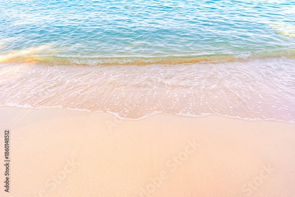 Obraz Soft blue ocean waves gently lapping onto a pristine tropical sandy beach