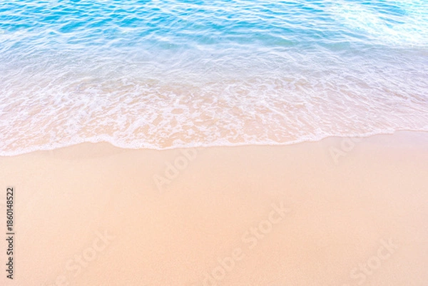 Obraz Soft blue ocean waves gently lapping onto a pristine tropical sandy beach