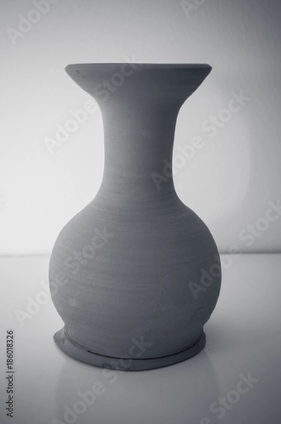 Obraz handmade clay vase with white background