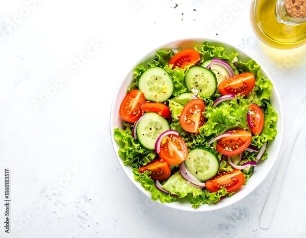 Obraz Fresh vegetable salad with lettuce, tomatoes, cucumbers, and onions