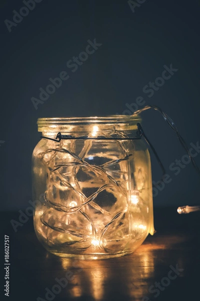 Obraz Glass jar with yellow lights