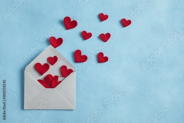 Obraz Love letter concept with open envelope and small red hearts with copy space
