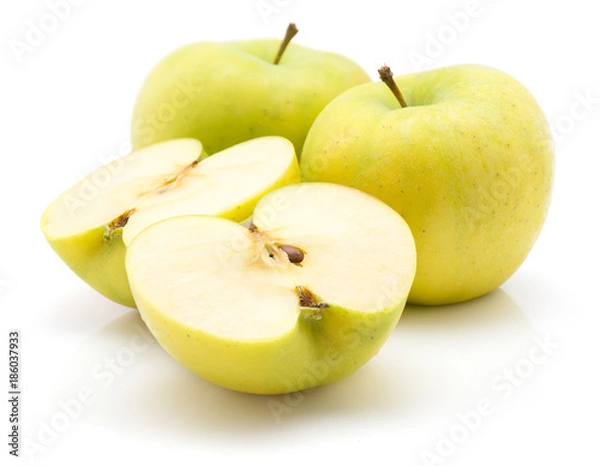 Fototapeta Two apple (Smeralda variety) halves and two whole isolated on white background green yellow.