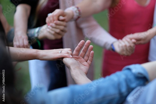 Fototapeta Woven hands of people during the performance of folk dance in the open air