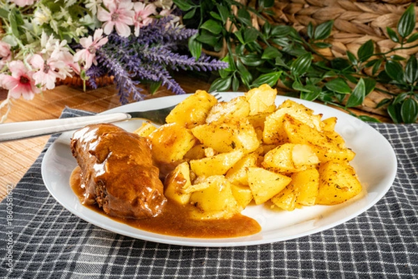 Obraz Beef roulade with baked potatoes.