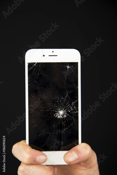Fototapeta The cracked screen is in the hand