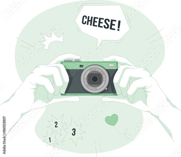 Obraz Hands holding a camera with a speech bubble saying cheese