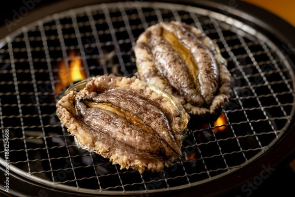 Obraz 鮑の炭火焼き