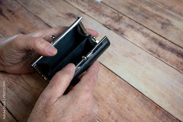 Obraz Empty Wallet Held by Elderly Hands