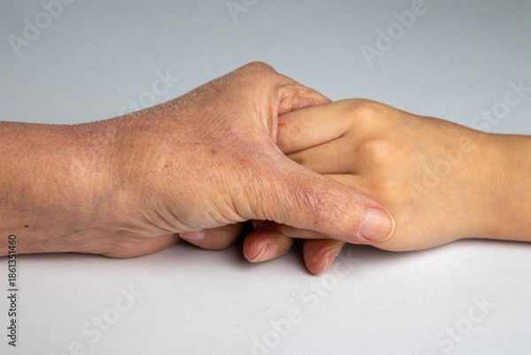 Obraz Young Hand Supporting Elderly Hand