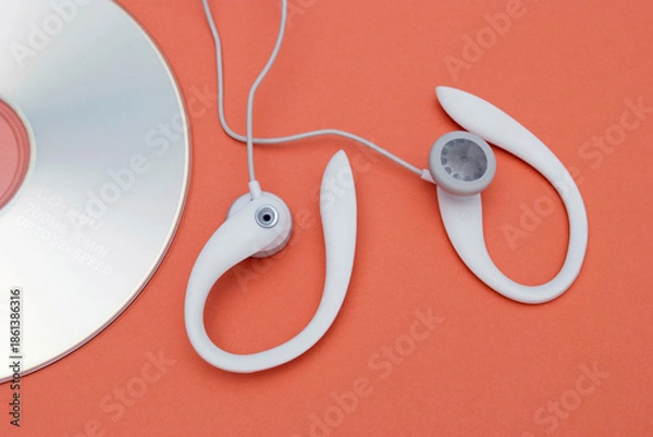 Obraz Earphones and compact disc