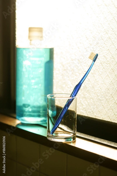 Obraz 青い歯ブラシと夕日