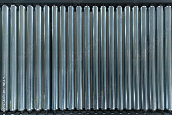 Fototapeta Crossing of the roller conveyor. Crossing of the roller conveyor, Production line conveyor roller transportation objects.