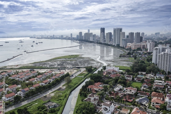 Fototapeta Scenic view of Gurney Drive with land reclamation activities, Penang, Malaysia