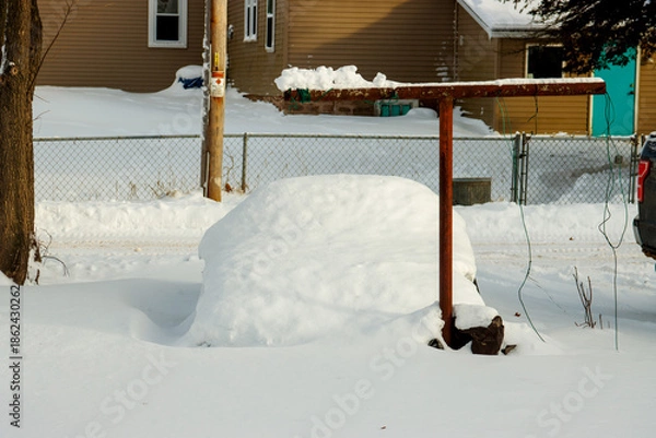 Obraz A car covered in snow