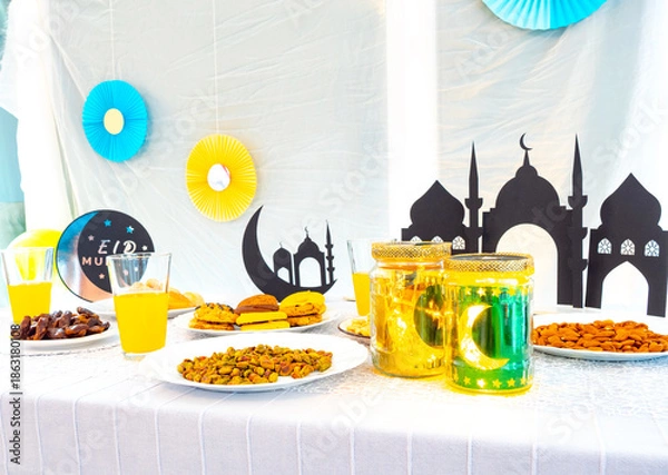 Obraz Eid Mubarak table with Ramadan sweets, dates, nuts and festive decor