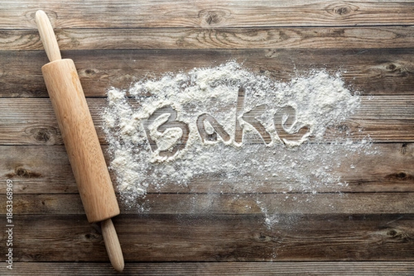 Obraz A baking concept background image with flour and a rolling pin.