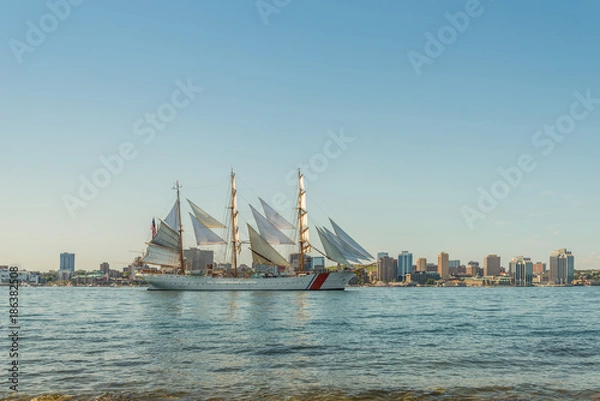 Fototapeta Tall ship in the harbour with Halifax downtown skyline on a sunny day