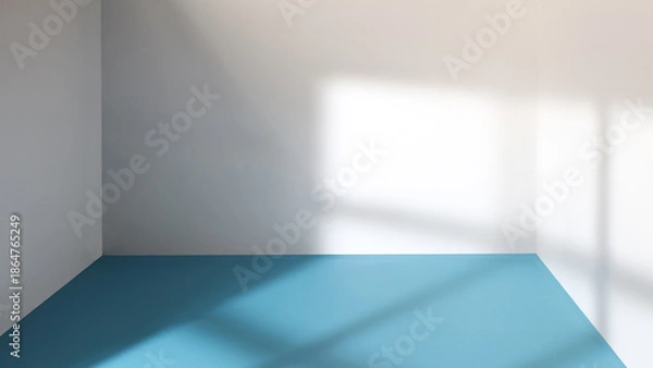 Obraz An empty room with sunlight streaming through a window.