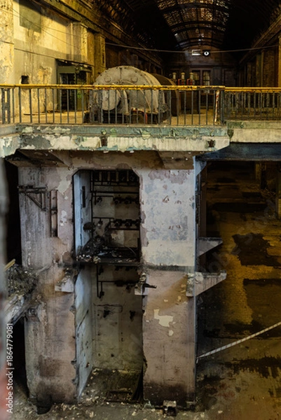 Obraz Abandoned power plant interior with generator