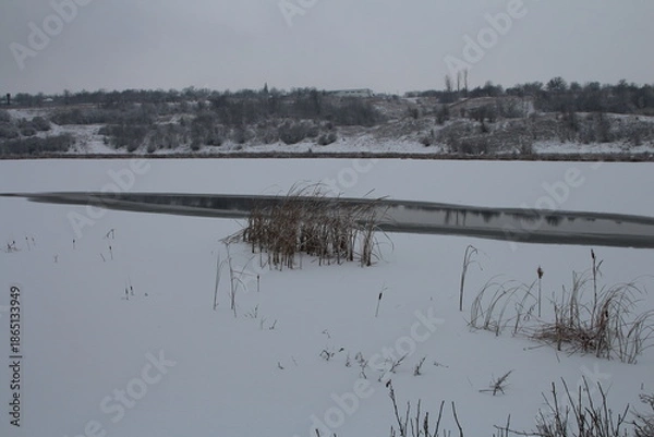 Obraz A snowy landscape with a river