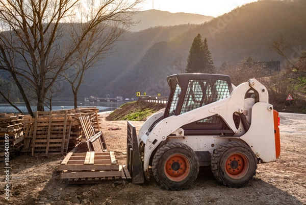 Obraz Small skid steer loader on construction site