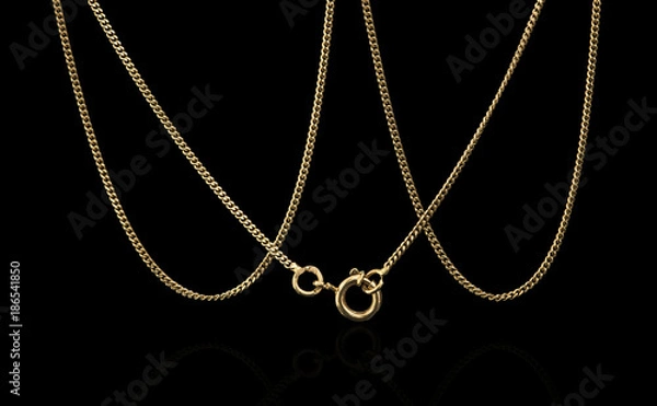 Fototapeta Unique gold necklace isolated on black background, macro closeup showing yellow chain links detail