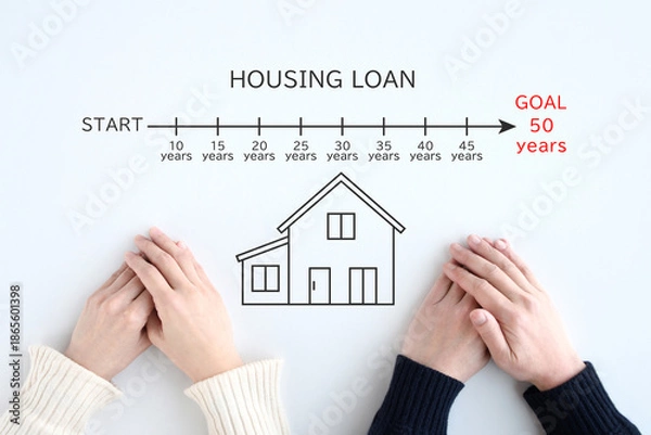 Obraz 50年の住宅ローンに関して考える若い夫婦の手元