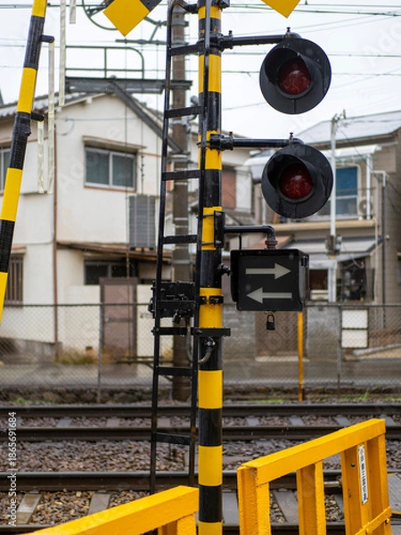 Obraz 雨に濡れた踏切の警報器