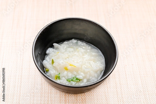 Obraz 黒い器に入ったお粥