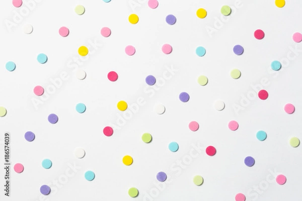 Fototapeta Confetti. Colorful dots view from above on a light background. Top view