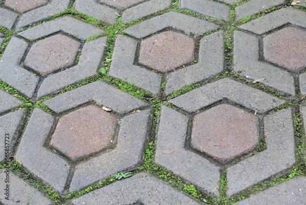 Obraz Old hexagonal pavement texture with worn concrete surface
