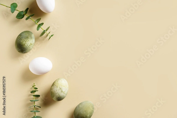 Obraz Easter concept background with brown eggs, eucalyptus leaves