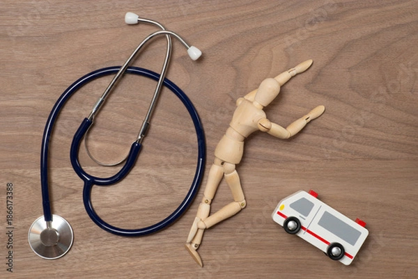 Fototapeta 倒れた人と救急車と聴診器