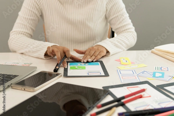 Obraz Creative web designer planning UI application and developing digital template