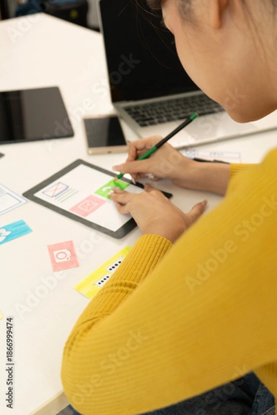 Obraz Creative web designer planning UI application and developing digital template