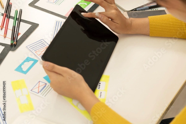 Obraz Creative web designer planning UI application and developing digital template